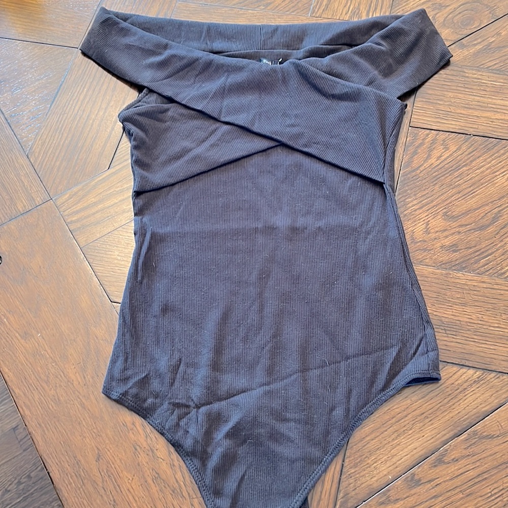 Off shoulder black bodysuit. Never worn NWT
